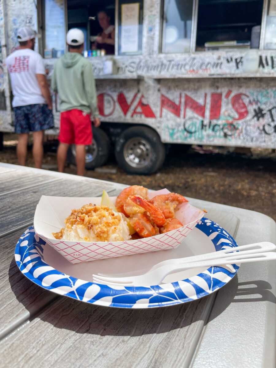 A half plate of scampi that consist of 6 shrimps and 1 scoop of rice.