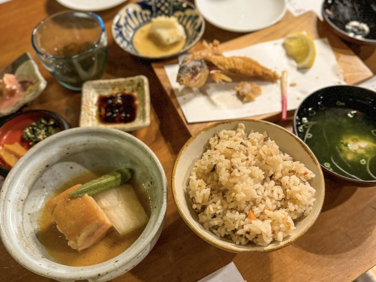 photo of a table with lots of local dishes