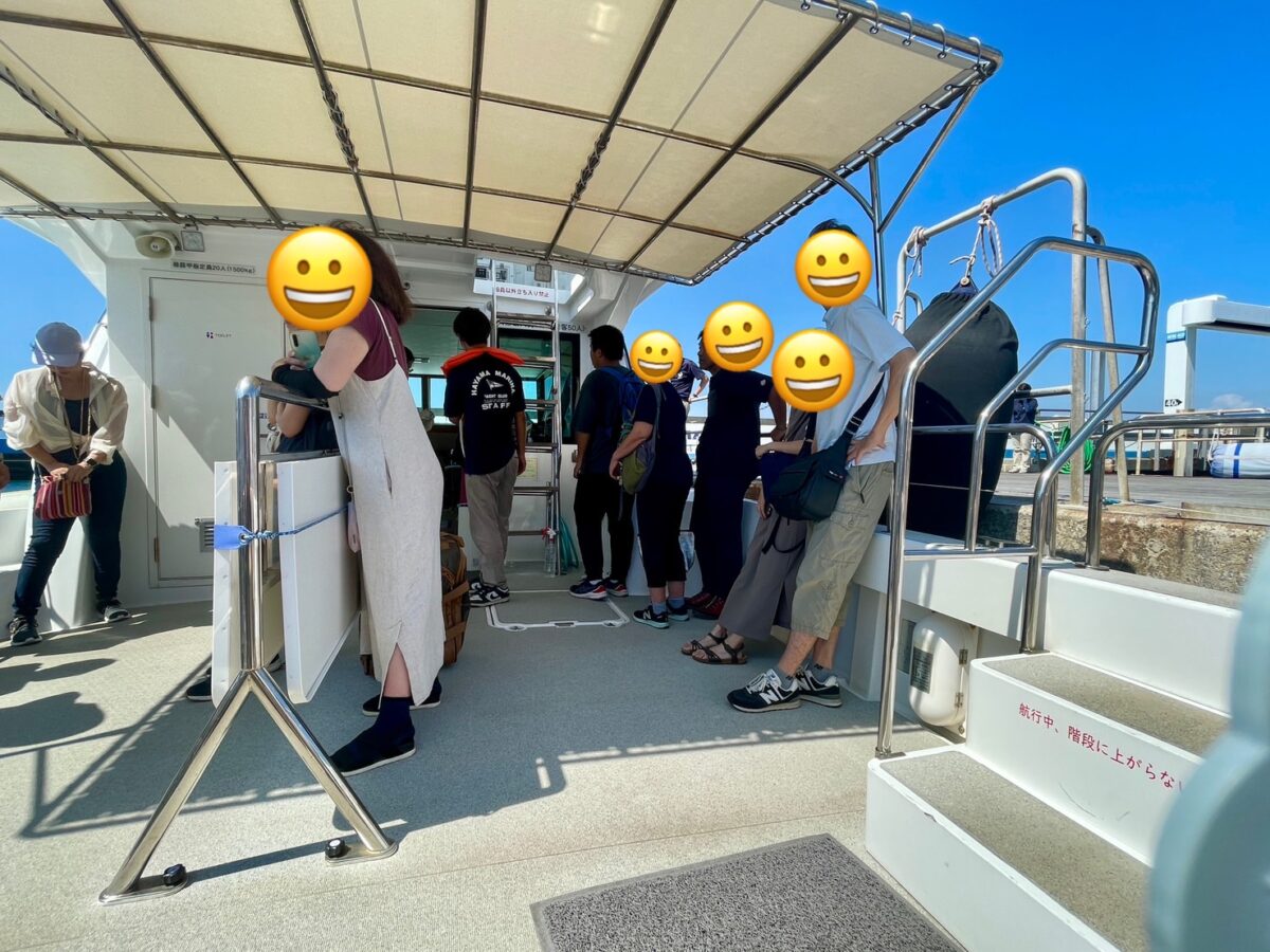 Passengers standing watch on a cruising ship